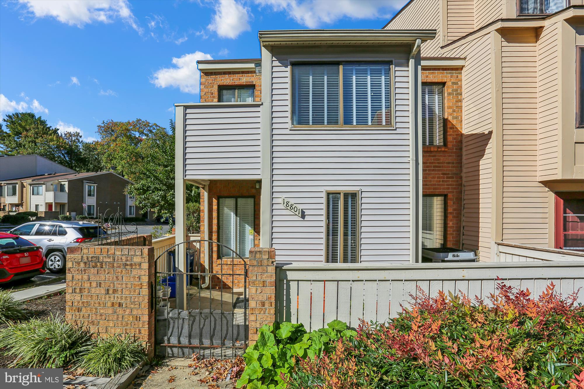 18801 Nathans Place Gaithersburg, MD 20886 - Photo 1 of 60 a front view of a house with a garden