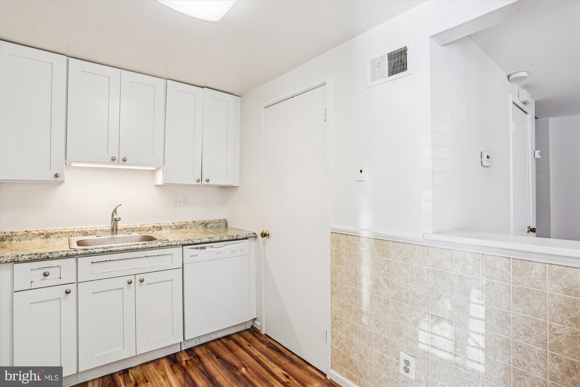 18801 Nathans Place Gaithersburg, MD 20886 - Photo 13 of 60 a kitchen with a sink and cabinets