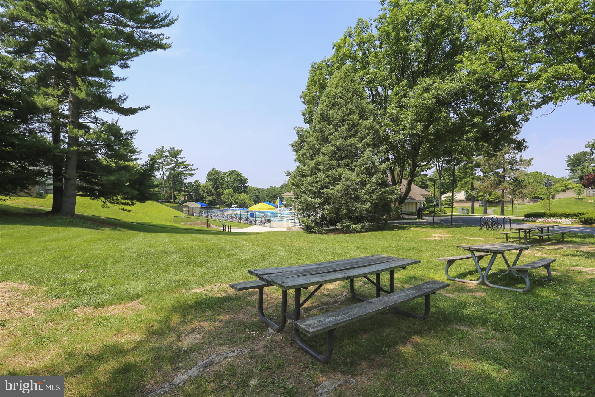 18801 Nathans Place Gaithersburg, MD 20886 - Photo 37 of 60 a bench sitting in the middle of a park