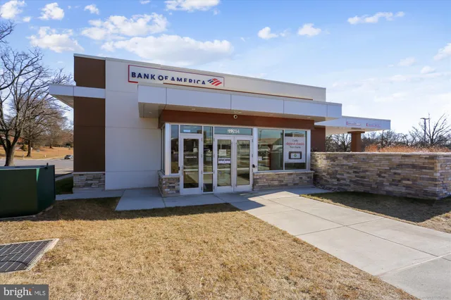 a view of a cafe with sitting area