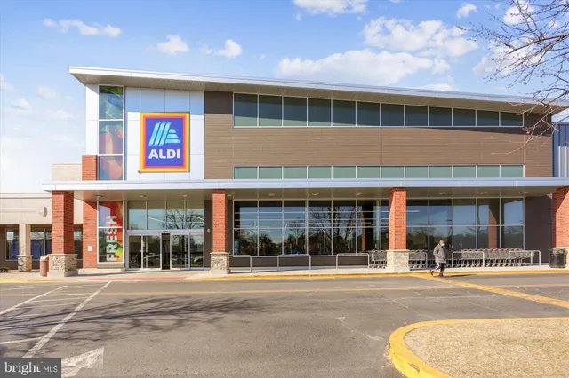 a view of a house with a large space and a car park view