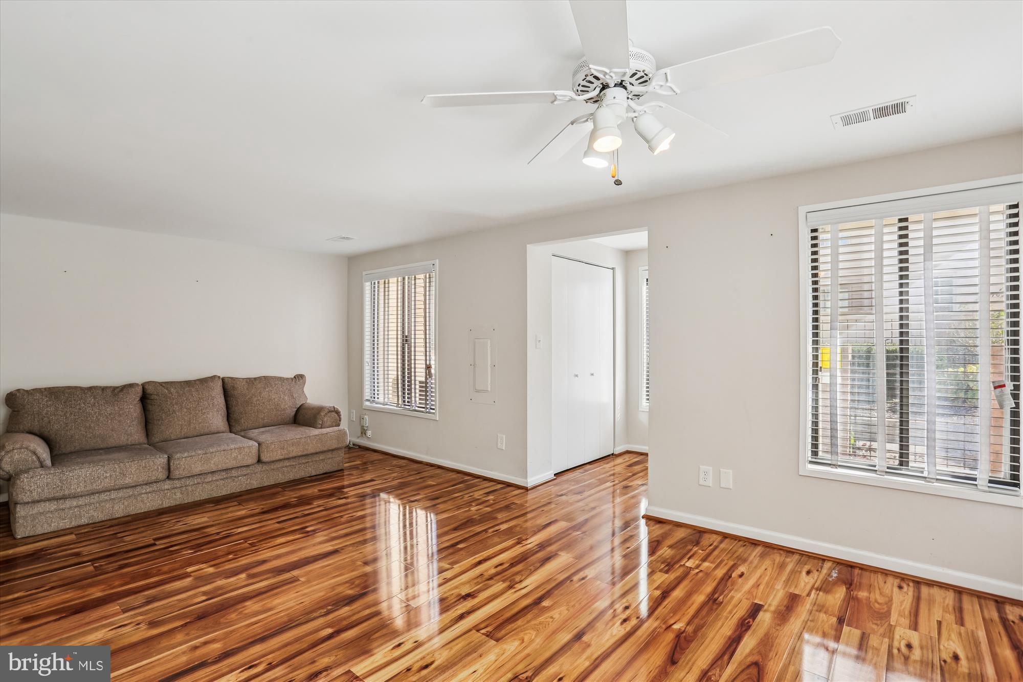 18801 Nathans Place Gaithersburg, MD 20886 - Photo 7 of 60 a living room with furniture and a large window