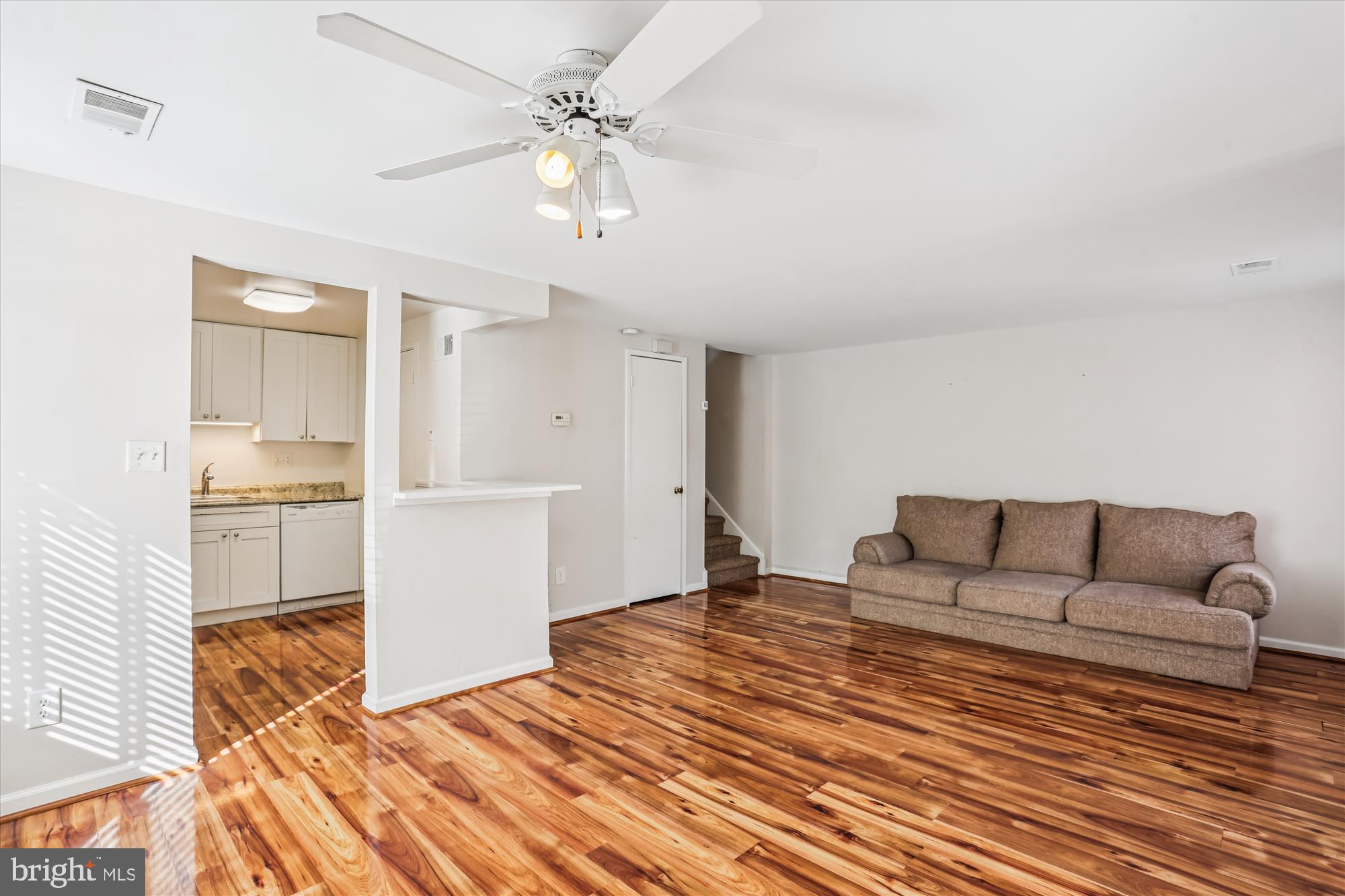 18801 Nathans Place Gaithersburg, MD 20886 - Photo 10 of 60 a living room with furniture and a chandelier