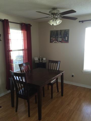 1784 Old Ranch Road Fort Walton Beach, FL 32547 - Photo 2 of 16 a view of a dining room with furniture window and wooden floor