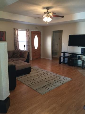 1784 Old Ranch Road Fort Walton Beach, FL 32547 - Photo 5 of 16 a living room with furniture and a flat screen tv