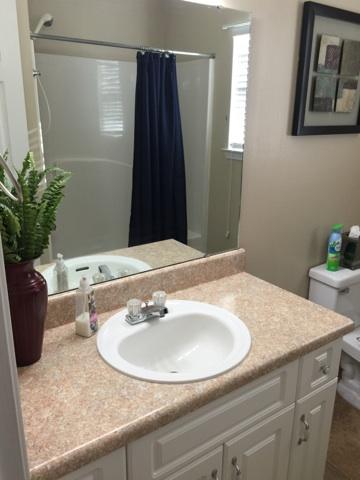 1784 Old Ranch Road Fort Walton Beach, FL 32547 - Photo 8 of 16 a bathroom with a granite countertop sink and a mirror