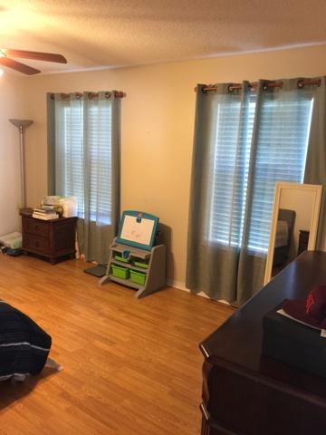 1784 Old Ranch Road Fort Walton Beach, FL 32547 - Photo 10 of 16 a bedroom with a bed and wooden floor
