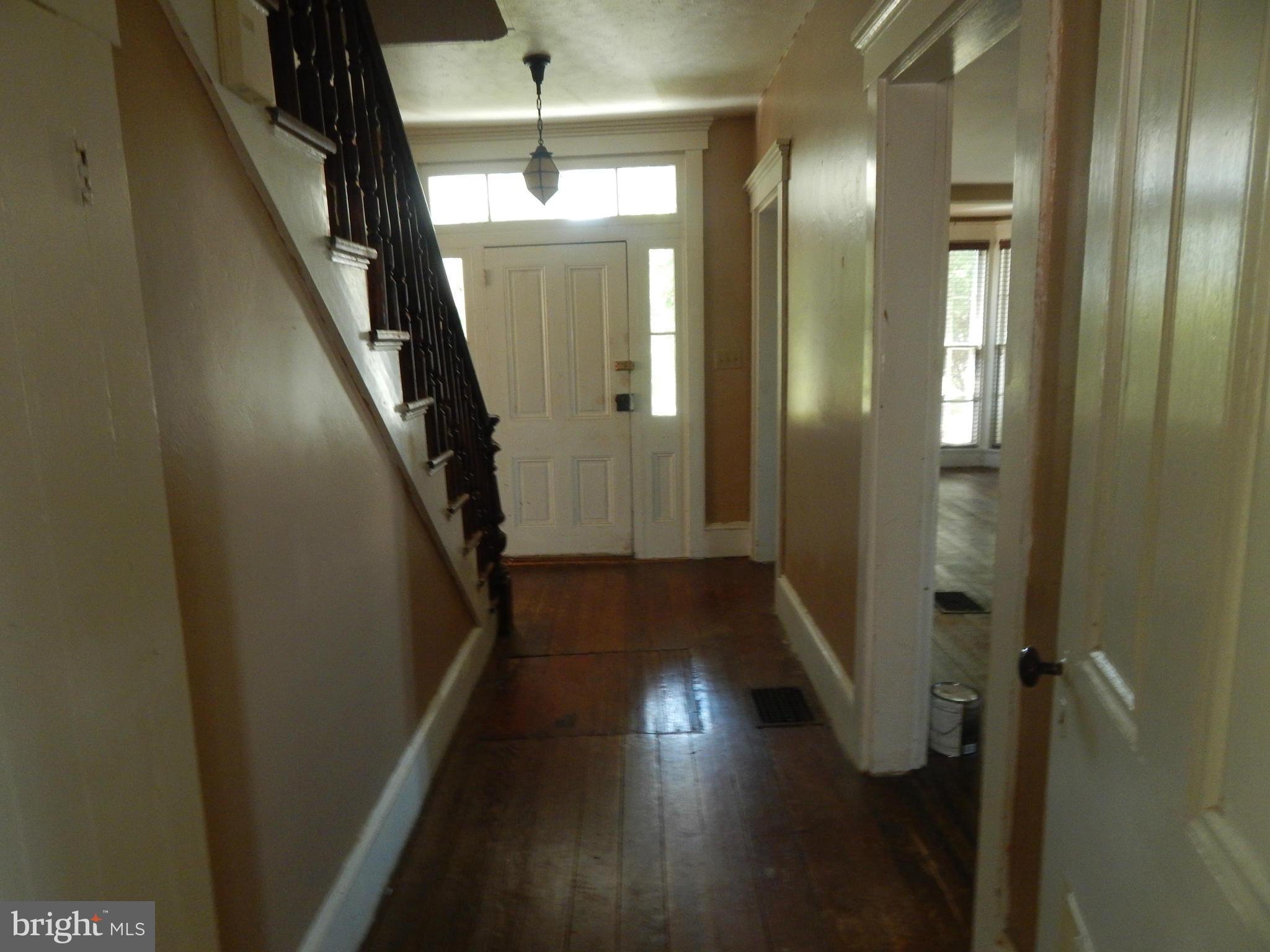 2443 Rocks Road Forest Hill, MD 21050 - Photo 2 of 21 a view of a hallway with wooden floor and staircase