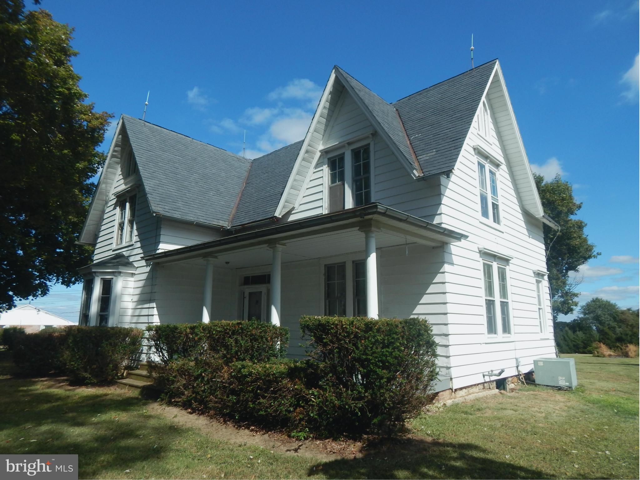 2443 Rocks Road Forest Hill, MD 21050 - Photo 18 of 21 a view of a white house with large windows and a yard