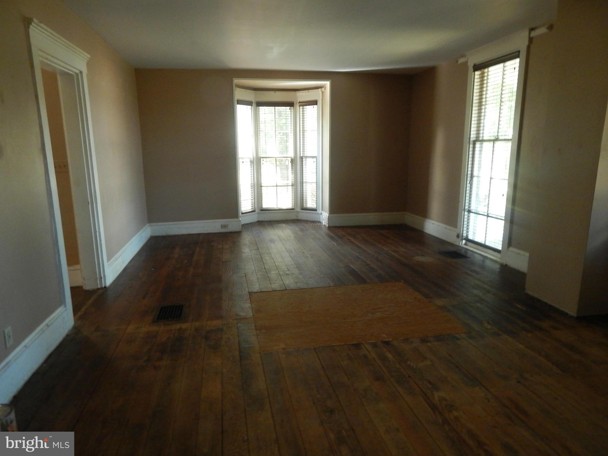 2443 Rocks Road Forest Hill, MD 21050 - Photo 3 of 21 an empty room with wooden floor and windows