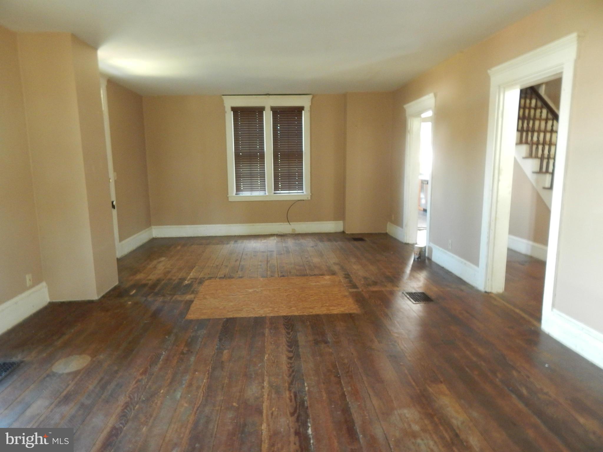 2443 Rocks Road Forest Hill, MD 21050 - Photo 4 of 21 an empty room with wooden floor and windows