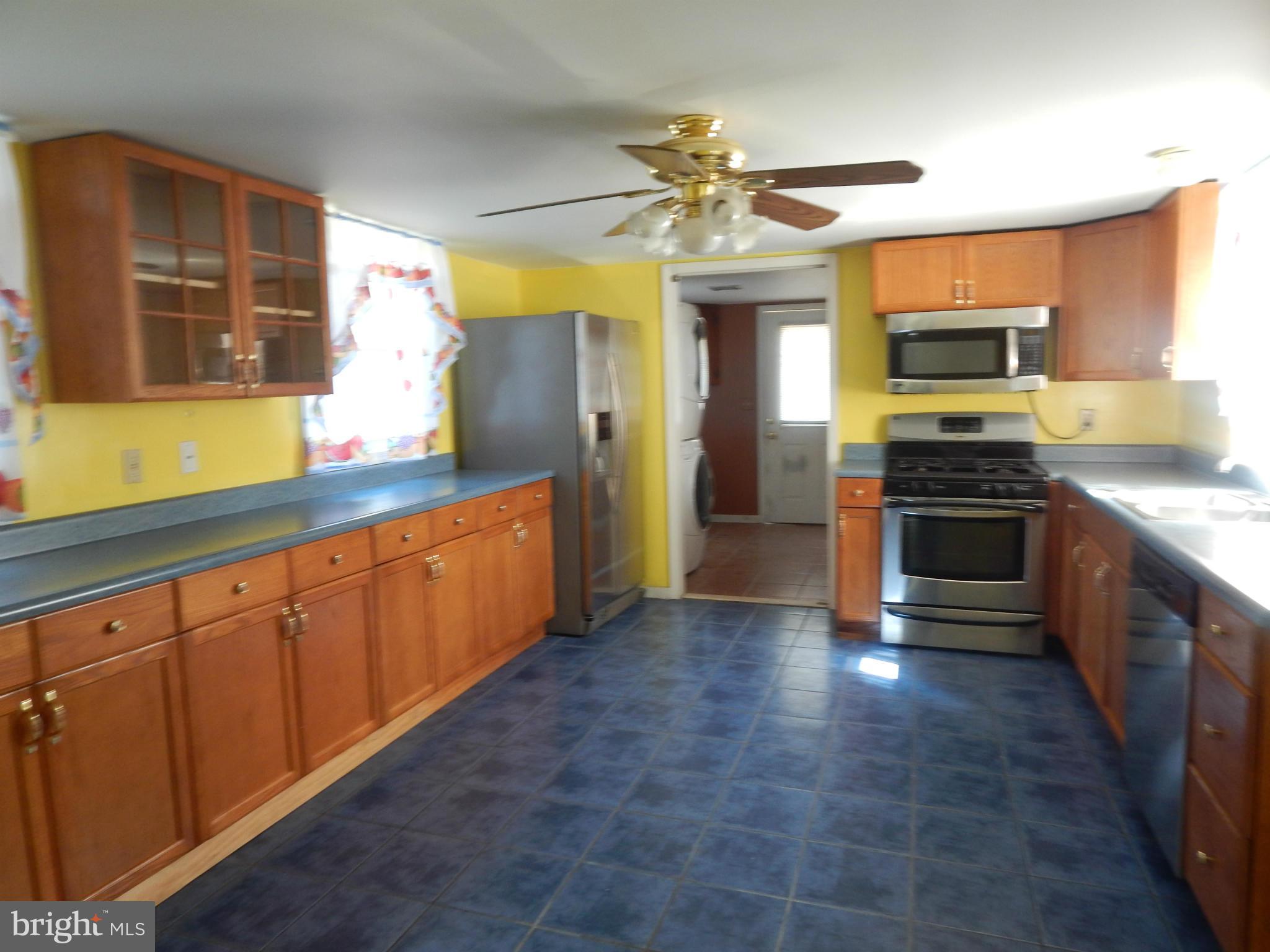 2443 Rocks Road Forest Hill, MD 21050 - Photo 8 of 21 a kitchen with stainless steel appliances granite countertop a stove and a sink