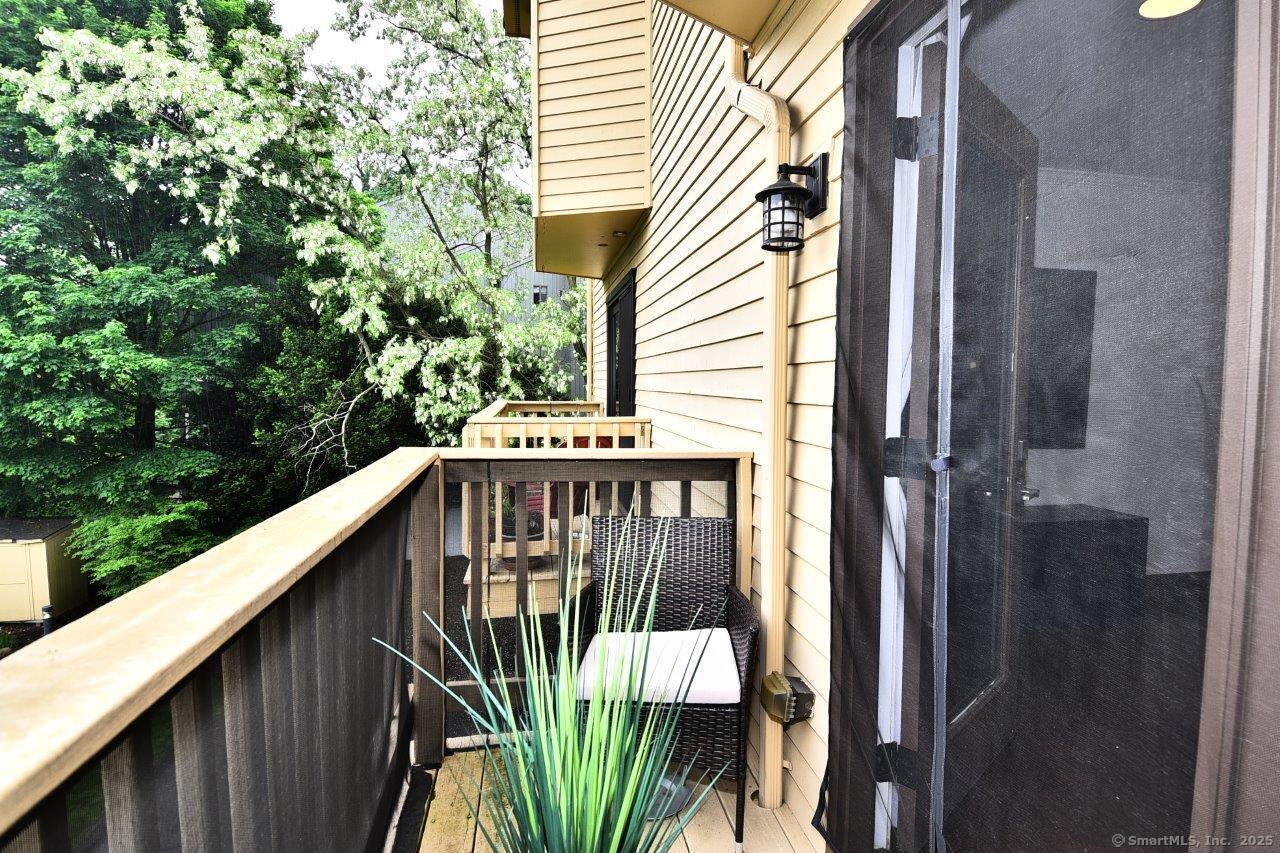 178 Flax Hill Road, Unit C203 Norwalk, CT 06854 - Photo 14 of 35 a view of a house with a street