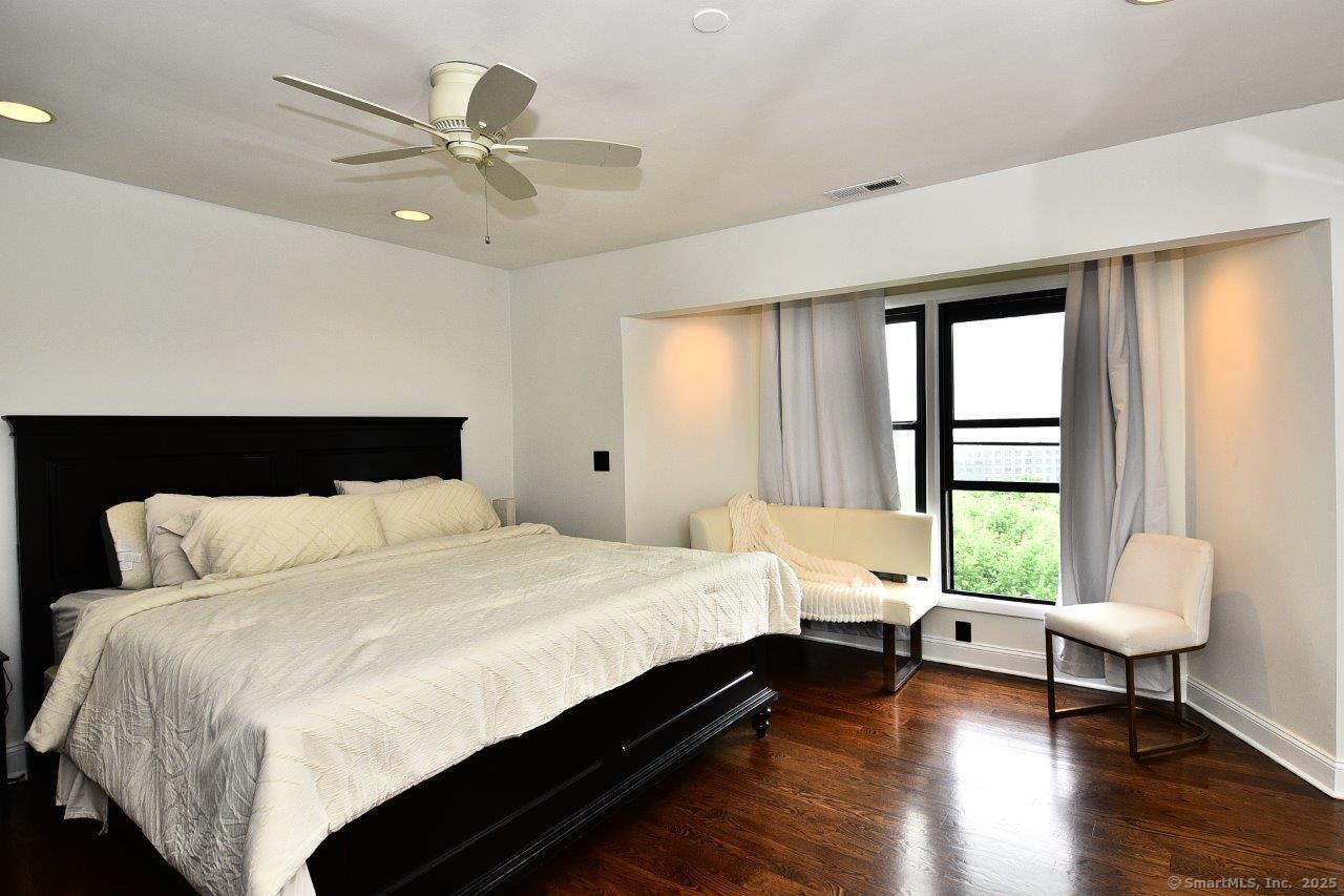 178 Flax Hill Road, Unit C203 Norwalk, CT 06854 - Photo 17 of 35 a bedroom with a bed and a window