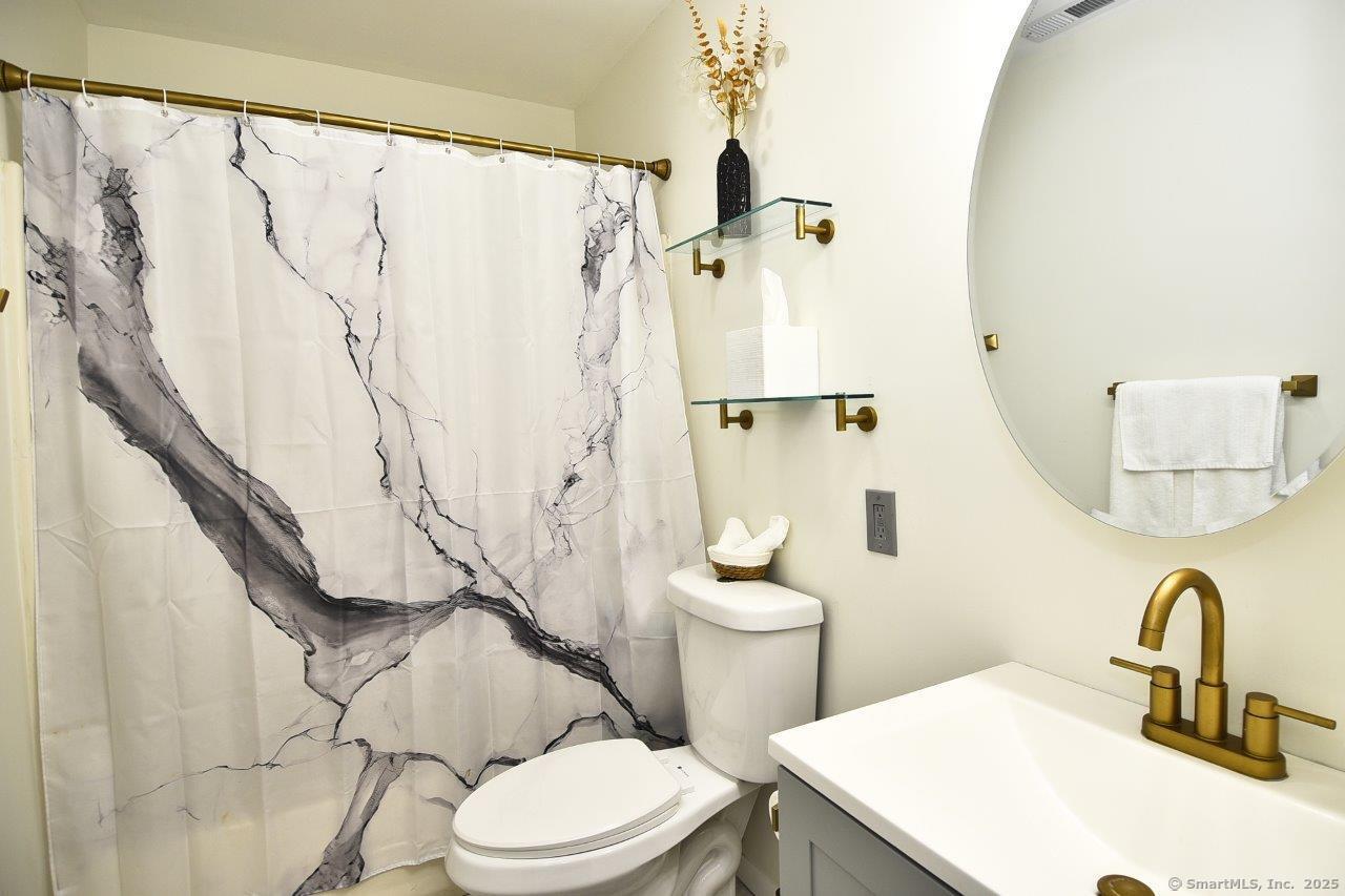 178 Flax Hill Road, Unit C203 Norwalk, CT 06854 - Photo 24 of 35 a bathroom with a sink toilet and shower