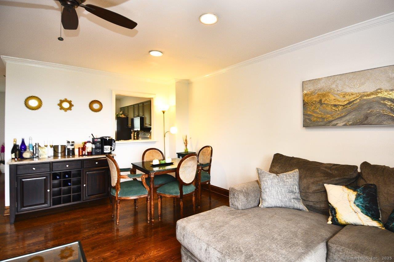 178 Flax Hill Road, Unit C203 Norwalk, CT 06854 - Photo 4 of 35 a living room with furniture and wooden floor