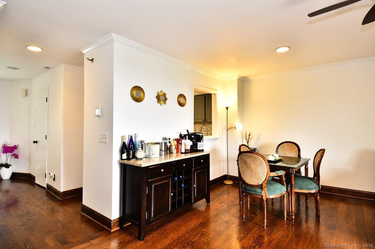 178 Flax Hill Road, Unit C203 Norwalk, CT 06854 - Photo 6 of 35 a view of a dining room with furniture and wooden floor