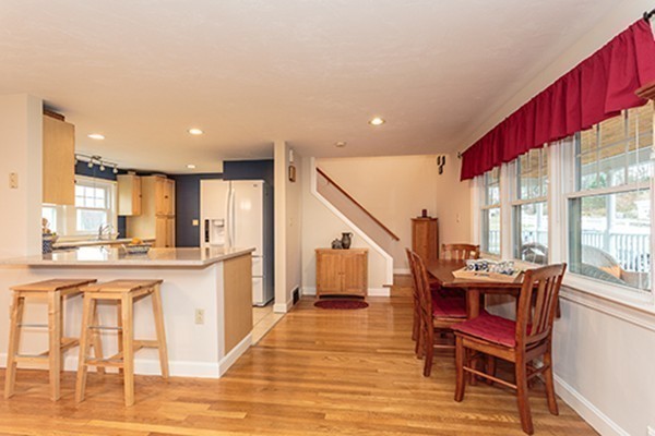 18 Proctor Road Chelmsford, MA 01824 - Photo 5 of 30 a view of a kitchen with dining room and wooden floor