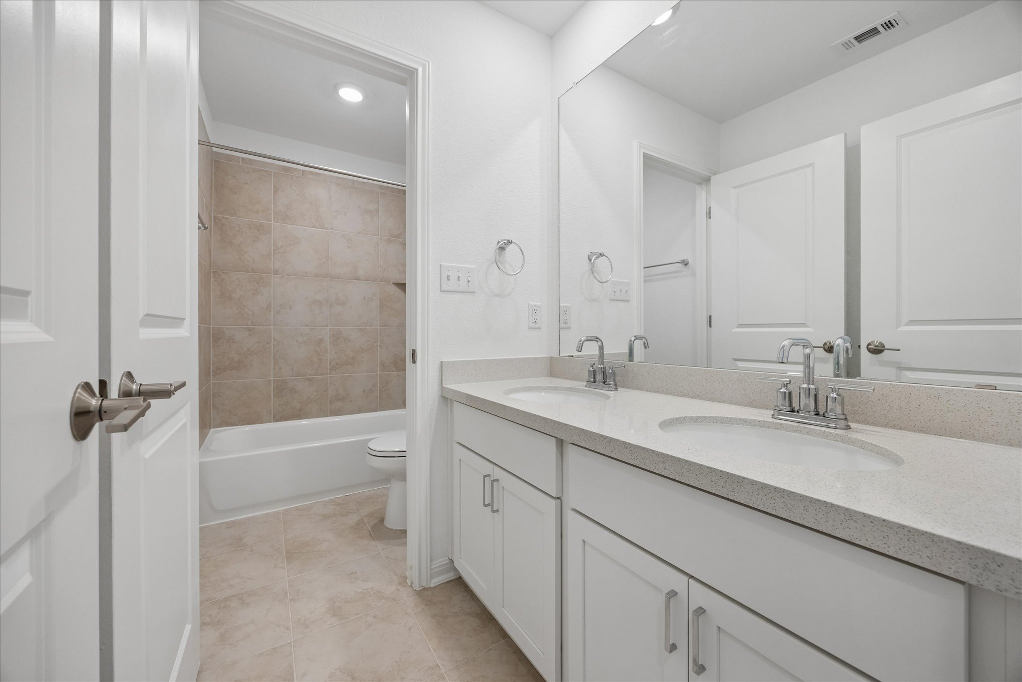 6407 Rounded Pebble Lane Buda, TX 78610 - Photo 24 of 32 Dual vanity with ample storage offers a pristine and functional bath space.