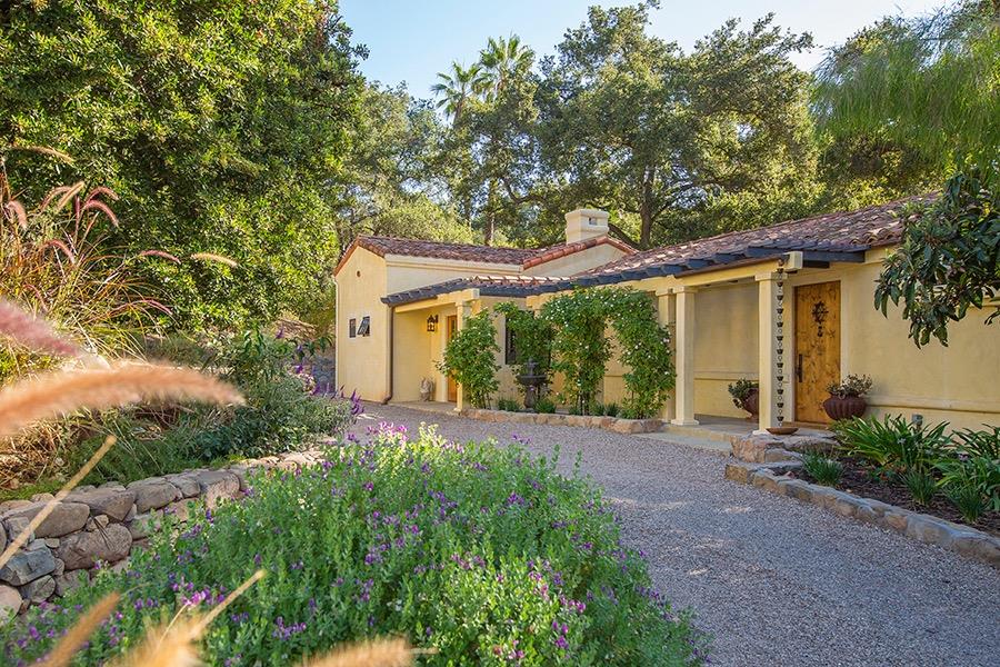 1369 Foothill Road Ojai, CA 93023 - Photo 1 of 30 a front view of a house with garden