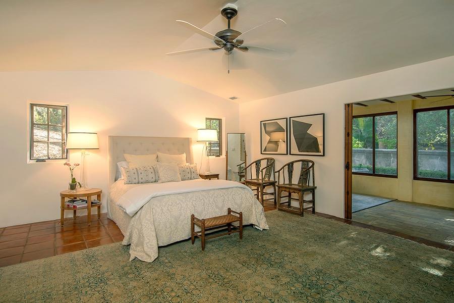 1369 Foothill Road Ojai, CA 93023 - Photo 11 of 30 a bedroom with a bed and a table