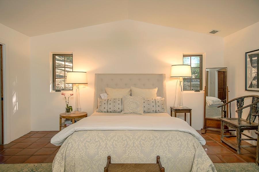 1369 Foothill Road Ojai, CA 93023 - Photo 12 of 30 a bedroom with a bed and wooden floor