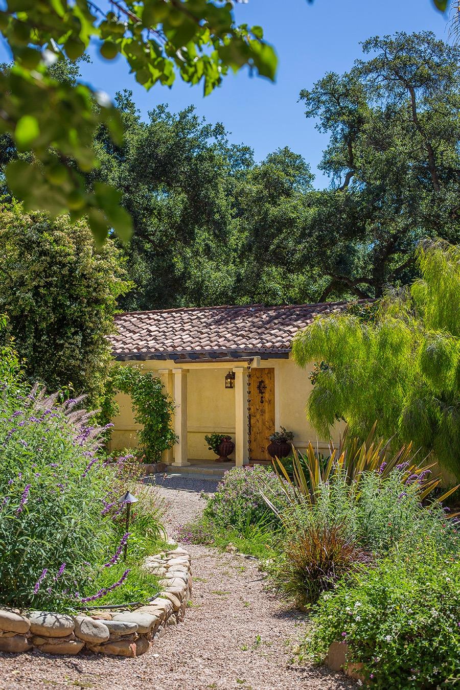 1369 Foothill Road Ojai, CA 93023 - Photo 18 of 30 a front view of a house with a yard