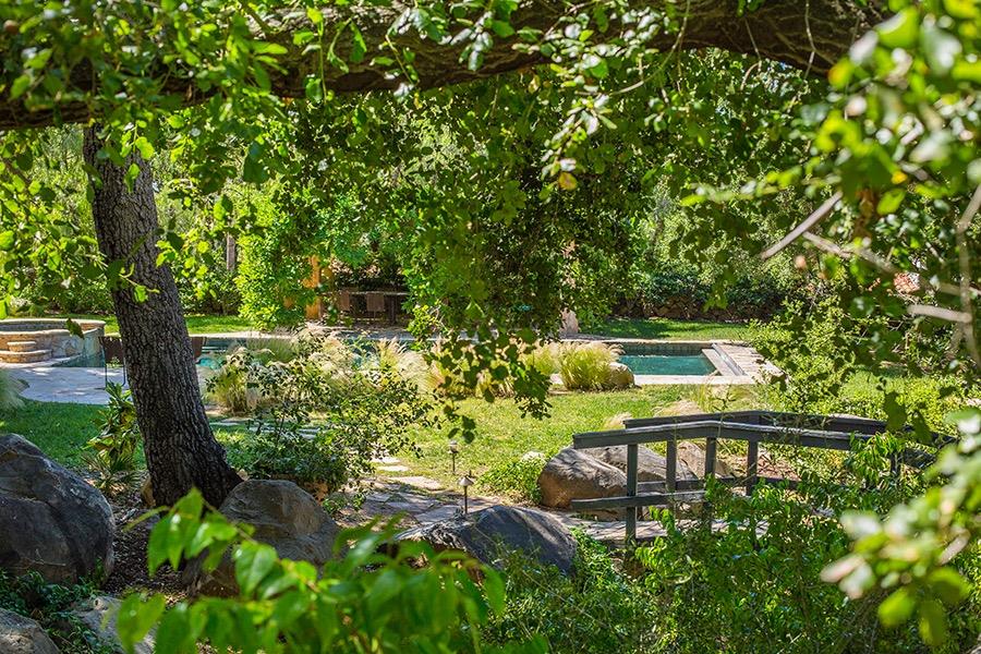 1369 Foothill Road Ojai, CA 93023 - Photo 21 of 30 a view of a lake with a bench