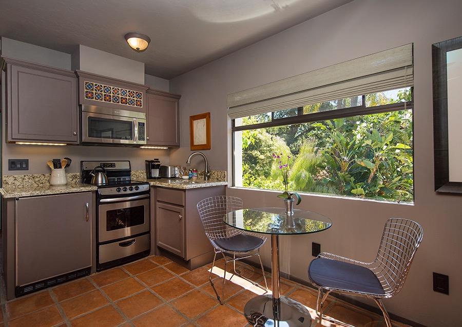 1369 Foothill Road Ojai, CA 93023 - Photo 23 of 30 a kitchen with a stove a sink and a microwave