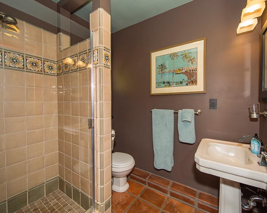 1369 Foothill Road Ojai, CA 93023 - Photo 25 of 30 a bathroom with a toilet sink and shower