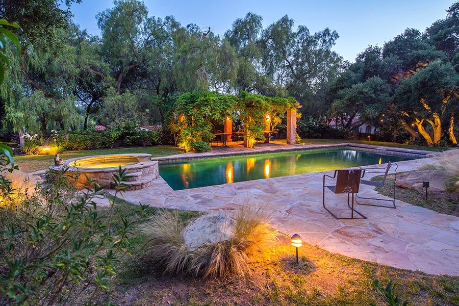 1369 Foothill Road Ojai, CA 93023 - Photo 3 of 30 a view of a swimming pool with a garden and plants