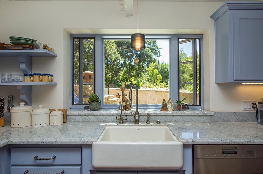 1369 Foothill Road Ojai, CA 93023 - Photo 8 of 30 a kitchen with sink a window and cabinets