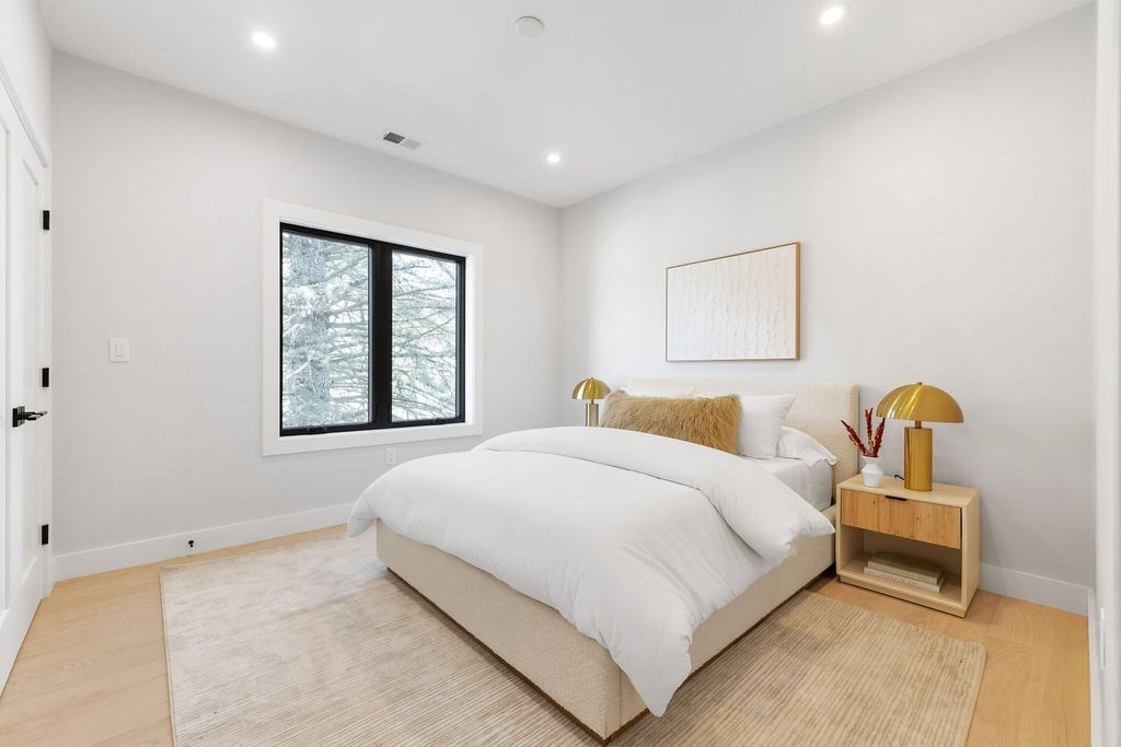 40 Otis, Unit L Needham, MA 02492 - Photo 13 of 19 a bedroom with bed and window