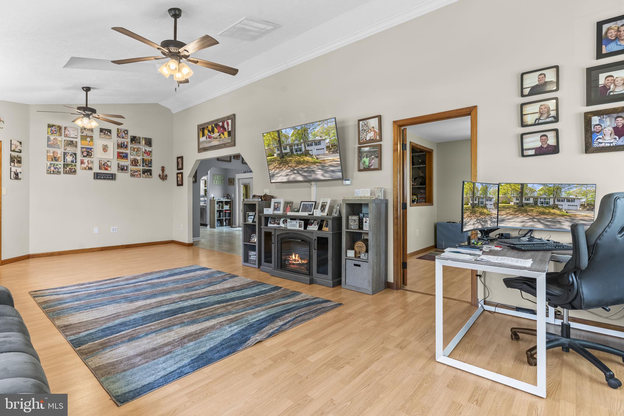 205 Pawnee Lane Lusby, MD 20657 - Photo 12 of 37 a room with lots of wooden furniture and a view of living room