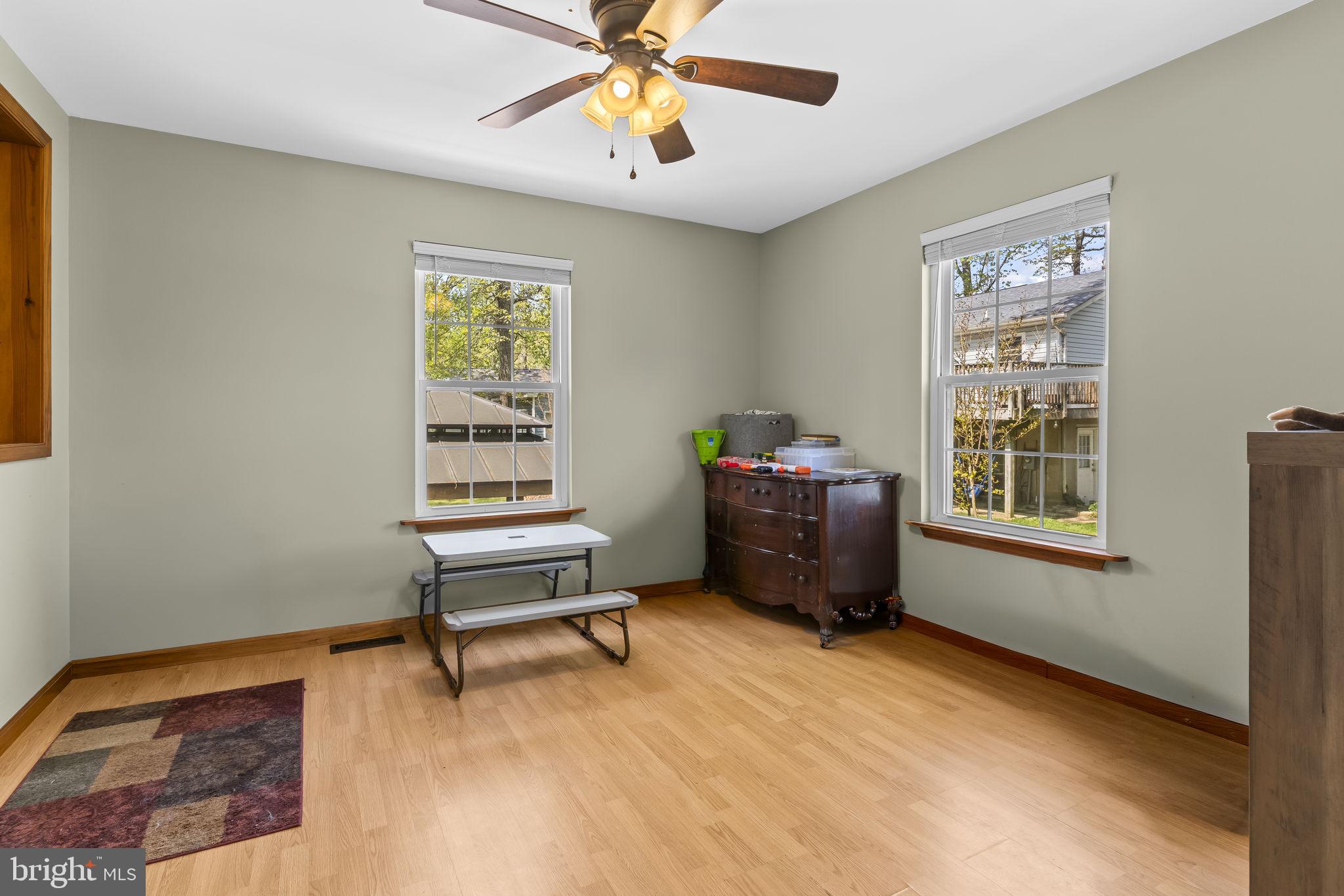 205 Pawnee Lane Lusby, MD 20657 - Photo 14 of 37 a living room with furniture and a window