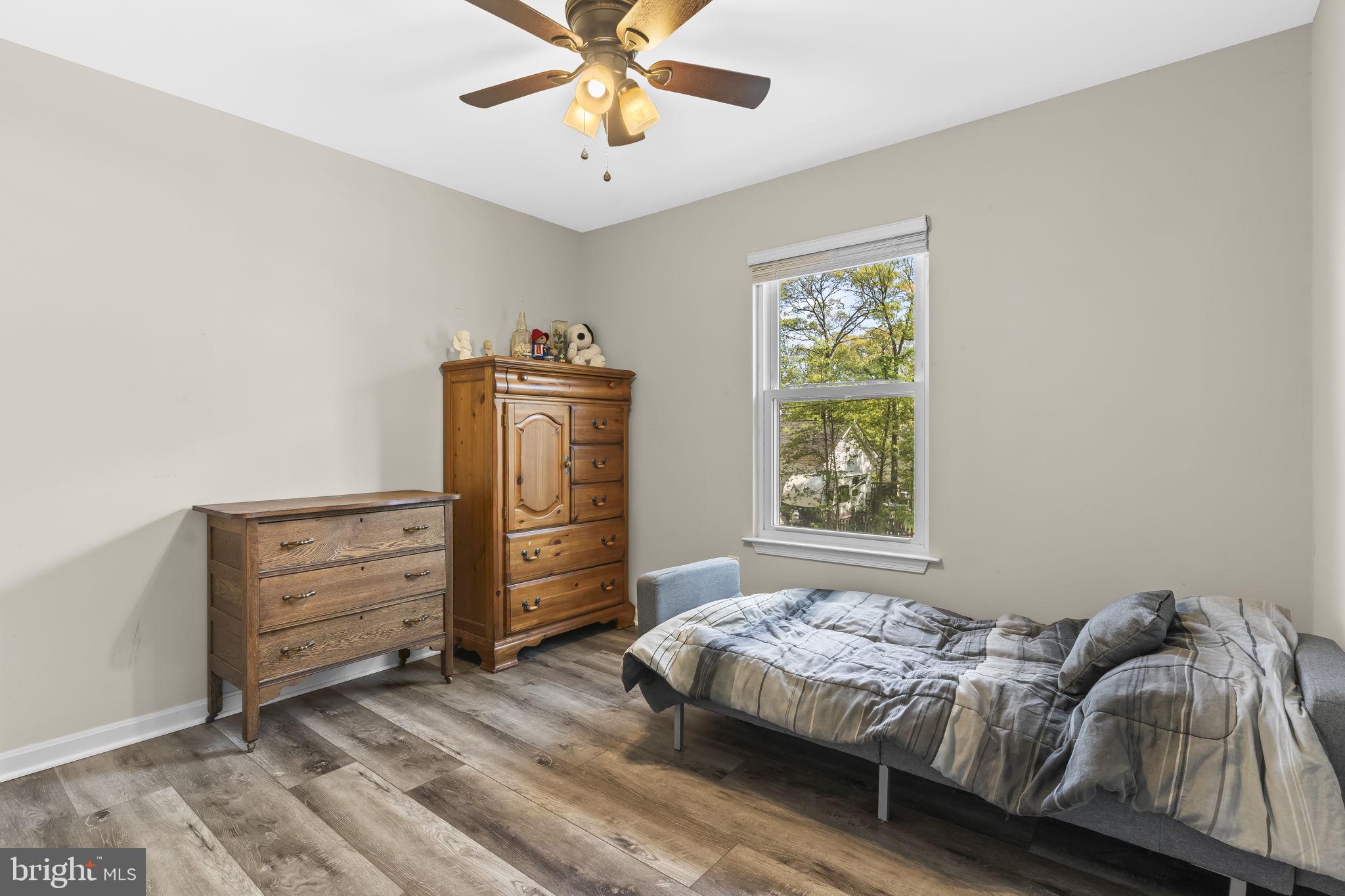 205 Pawnee Lane Lusby, MD 20657 - Photo 15 of 37 a bedroom with a bed and a window