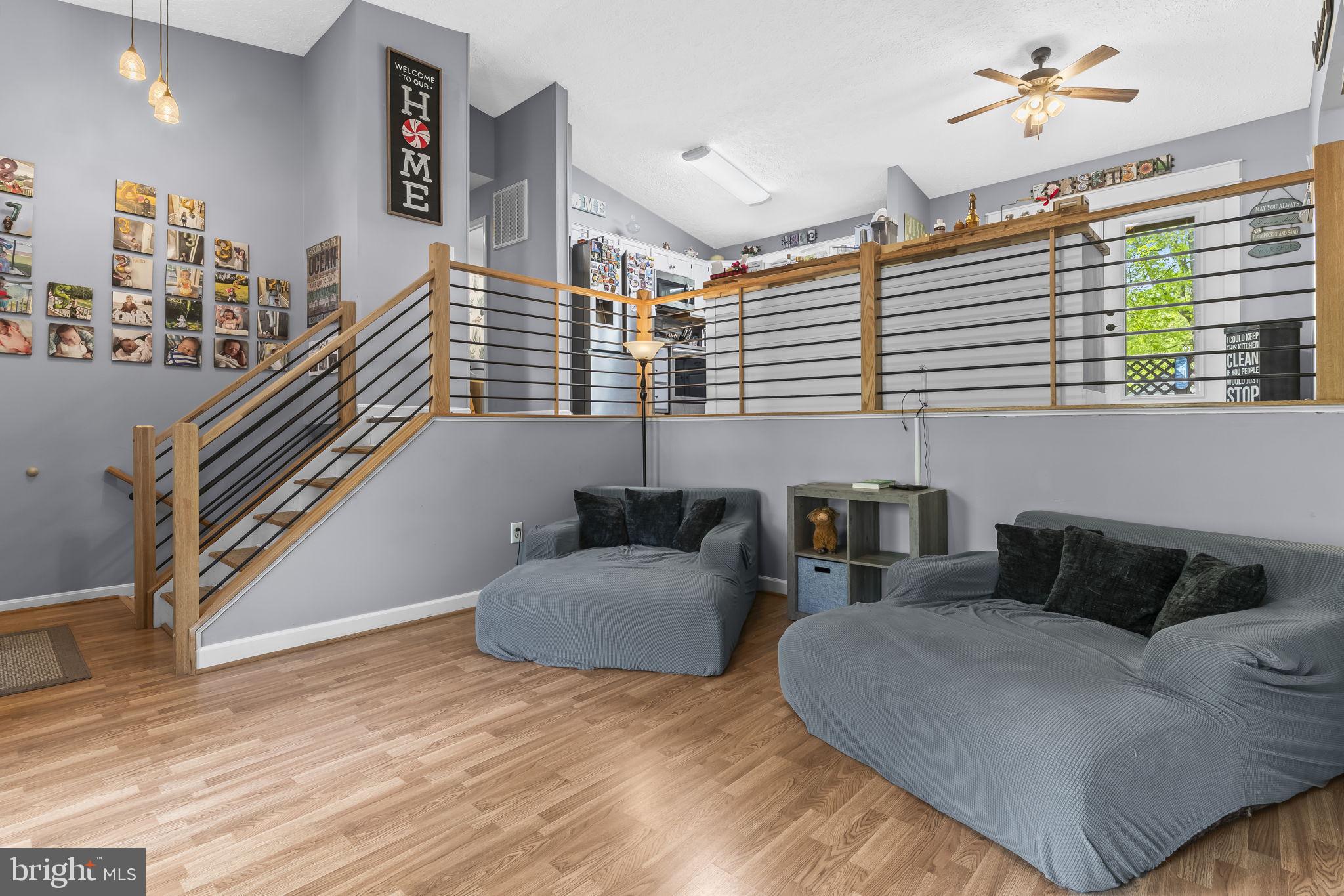205 Pawnee Lane Lusby, MD 20657 - Photo 3 of 37 a living room with furniture and stairs