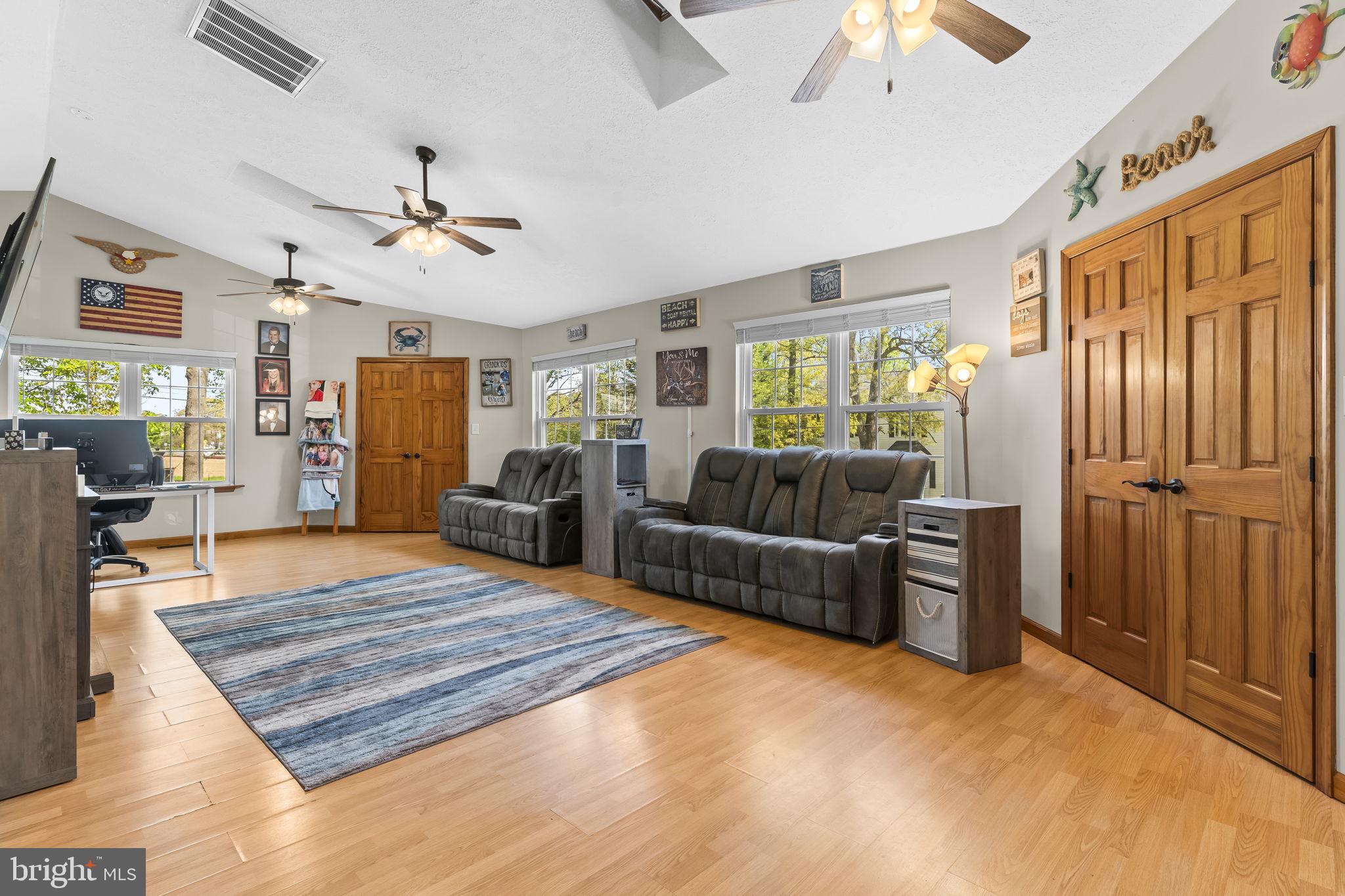 205 Pawnee Lane Lusby, MD 20657 - Photo 10 of 37 a living room with furniture and a wooden floor