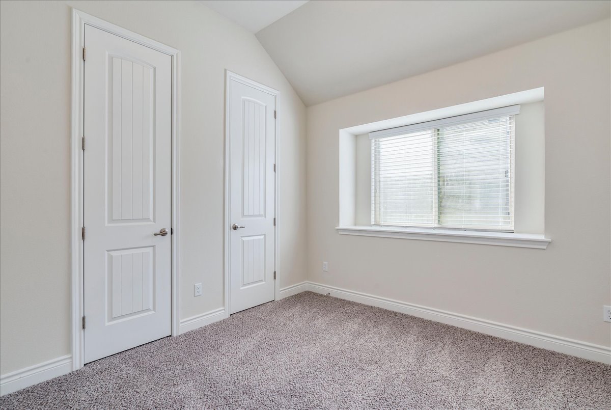 124 Compass Lane Kyle, TX 78640 - Photo 19 of 38 a view of an empty room with a window