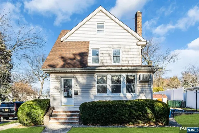 a view of a house with a yard and plants