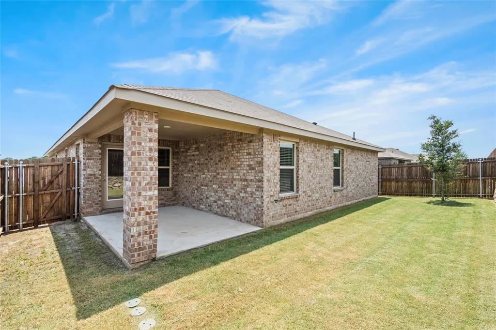 171 Seabiscuit Road Caddo Mills, TX 75135 - Photo 18 of 19 a front view of a house with a yard