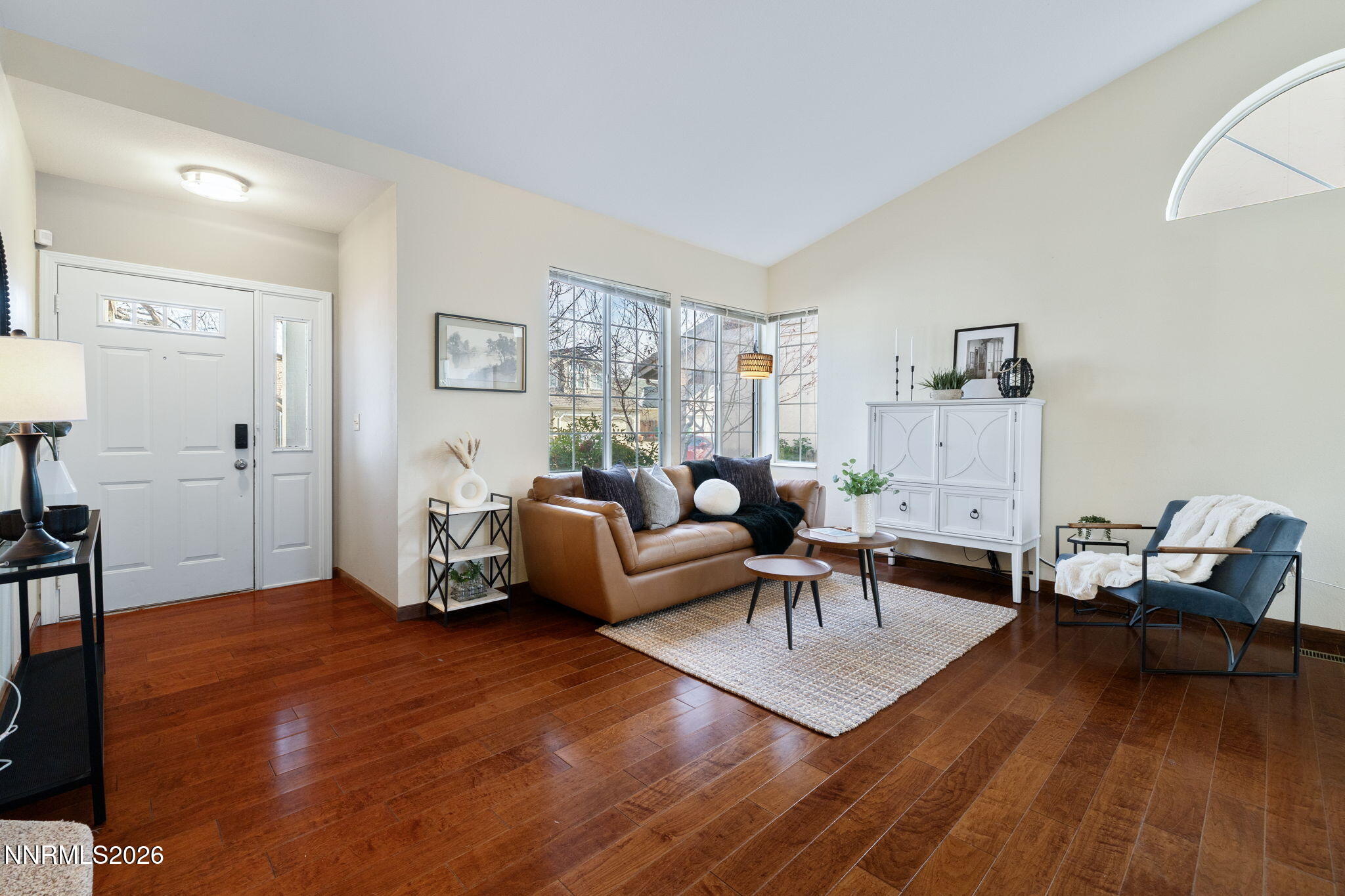 6055 Stonecreek Drive Reno, NV 89511 - Photo 10 of 28 a living room with furniture and a wooden floor