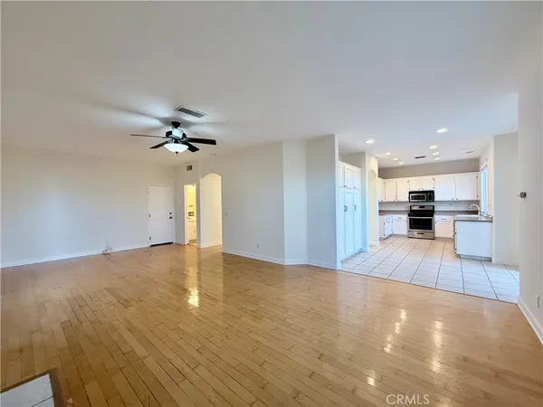 a view of a kitchen with a sink and a large window