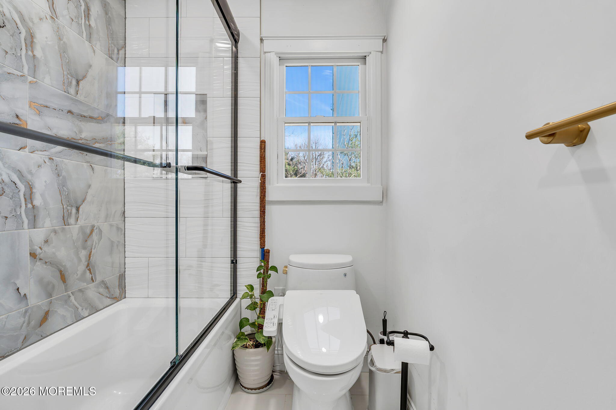 50 Virginia Drive Howell, NJ 07731 - Photo 15 of 33 a white toilet sitting next to a bath tub