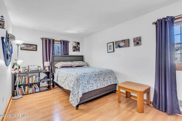 a bedroom with a bed and a table in it