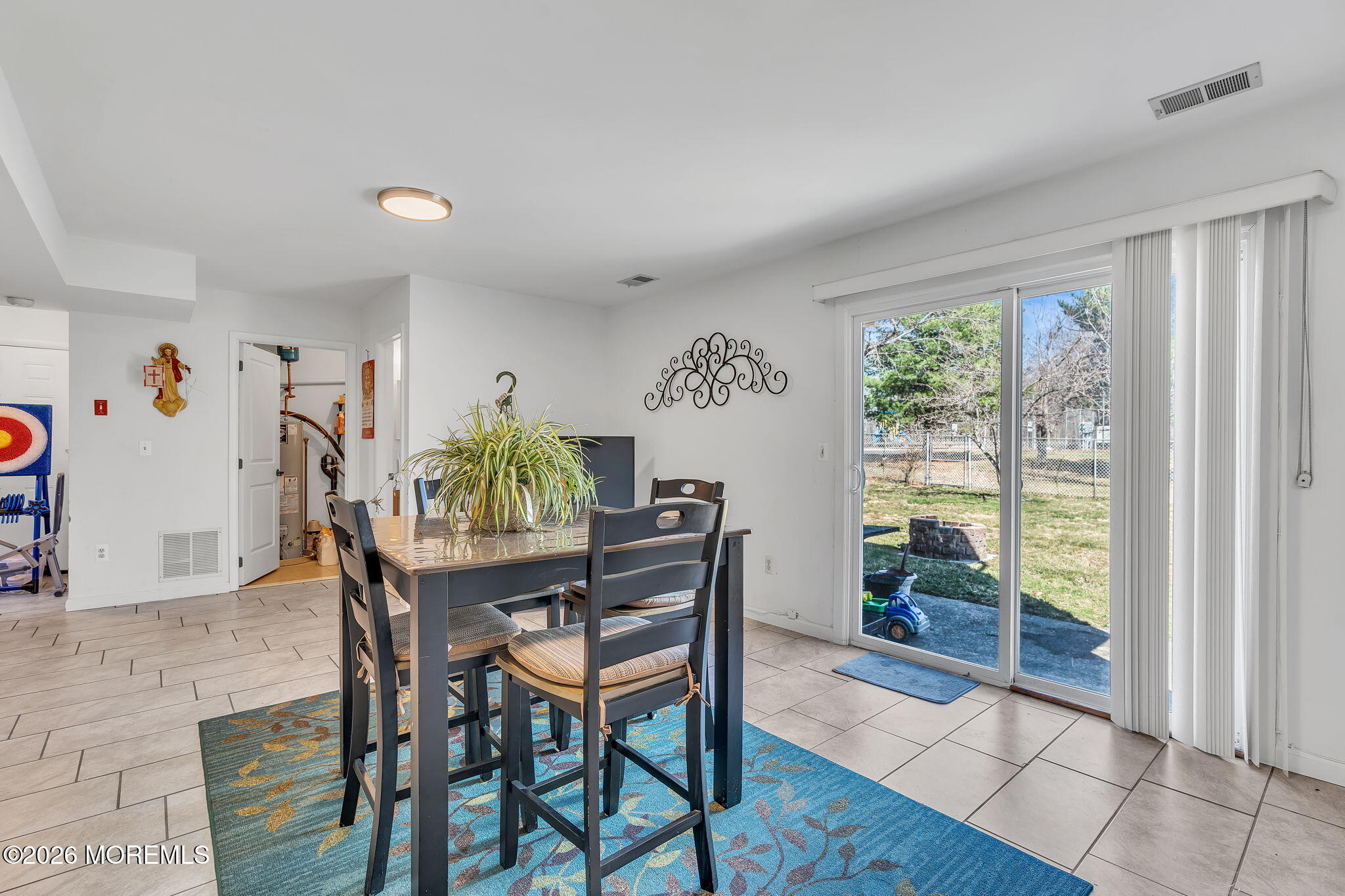 50 Virginia Drive Howell, NJ 07731 - Photo 24 of 33 a view of a dining room with furniture and a potted plant
