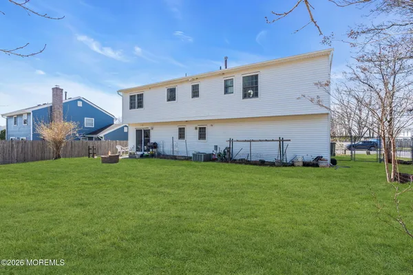 a view of a house with a back yard