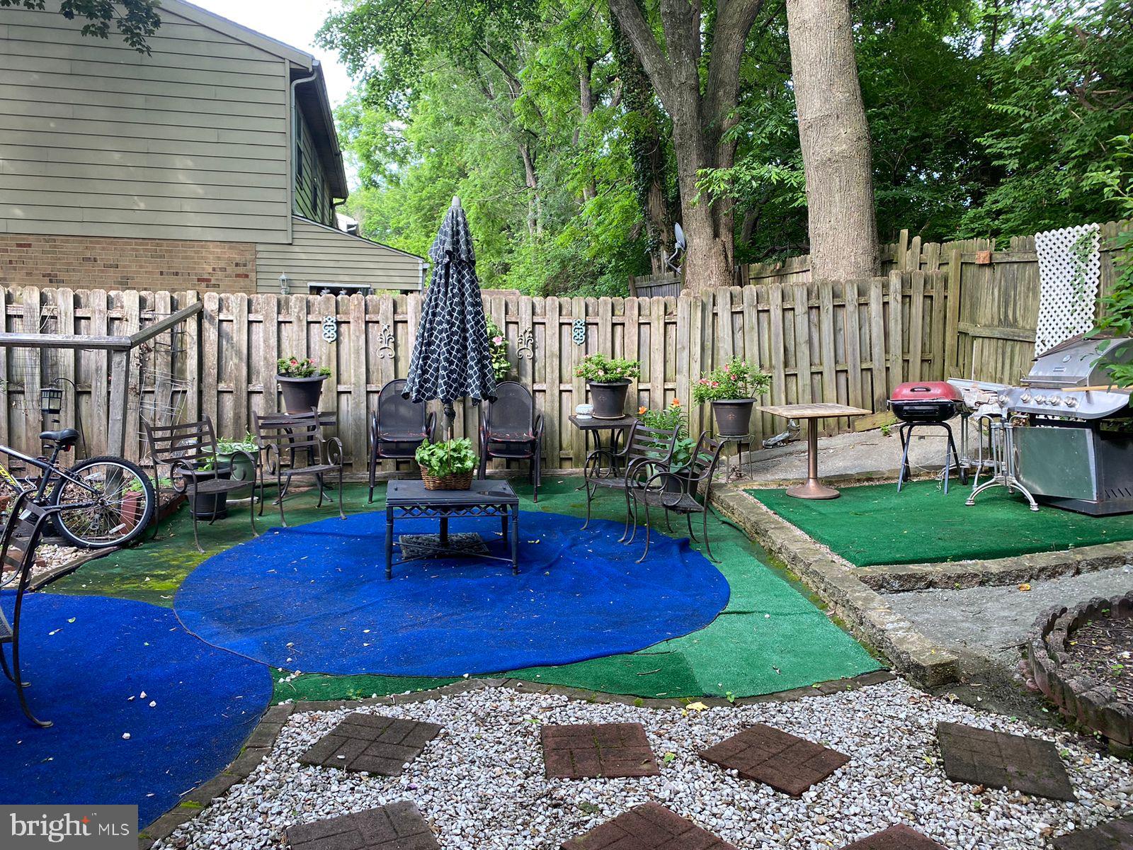 8434 Towne Crest Court Gaithersburg, MD 20877 - Photo 7 of 8 a view of a backyard with sitting area and furniture