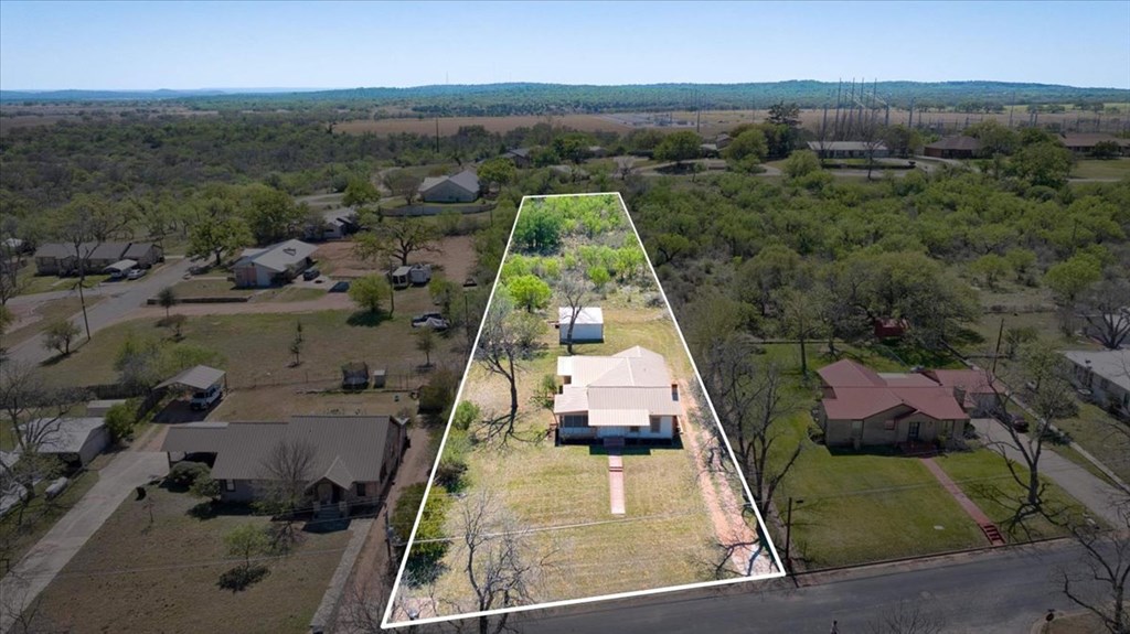 205 East Rainey Street Mason, TX 76856 - Photo 2 of 37 an aerial view of residential houses with outdoor space