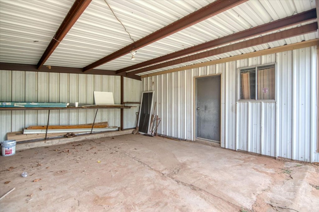 205 East Rainey Street Mason, TX 76856 - Photo 26 of 37 an empty room with sliding door
